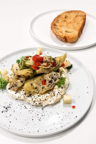 Whipped ricotta with artichoke, olive, apple, parsley and house-made bread at Oren