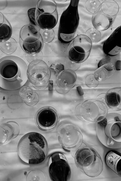 Wine glasses and bottles arranged on a dining table at Oren